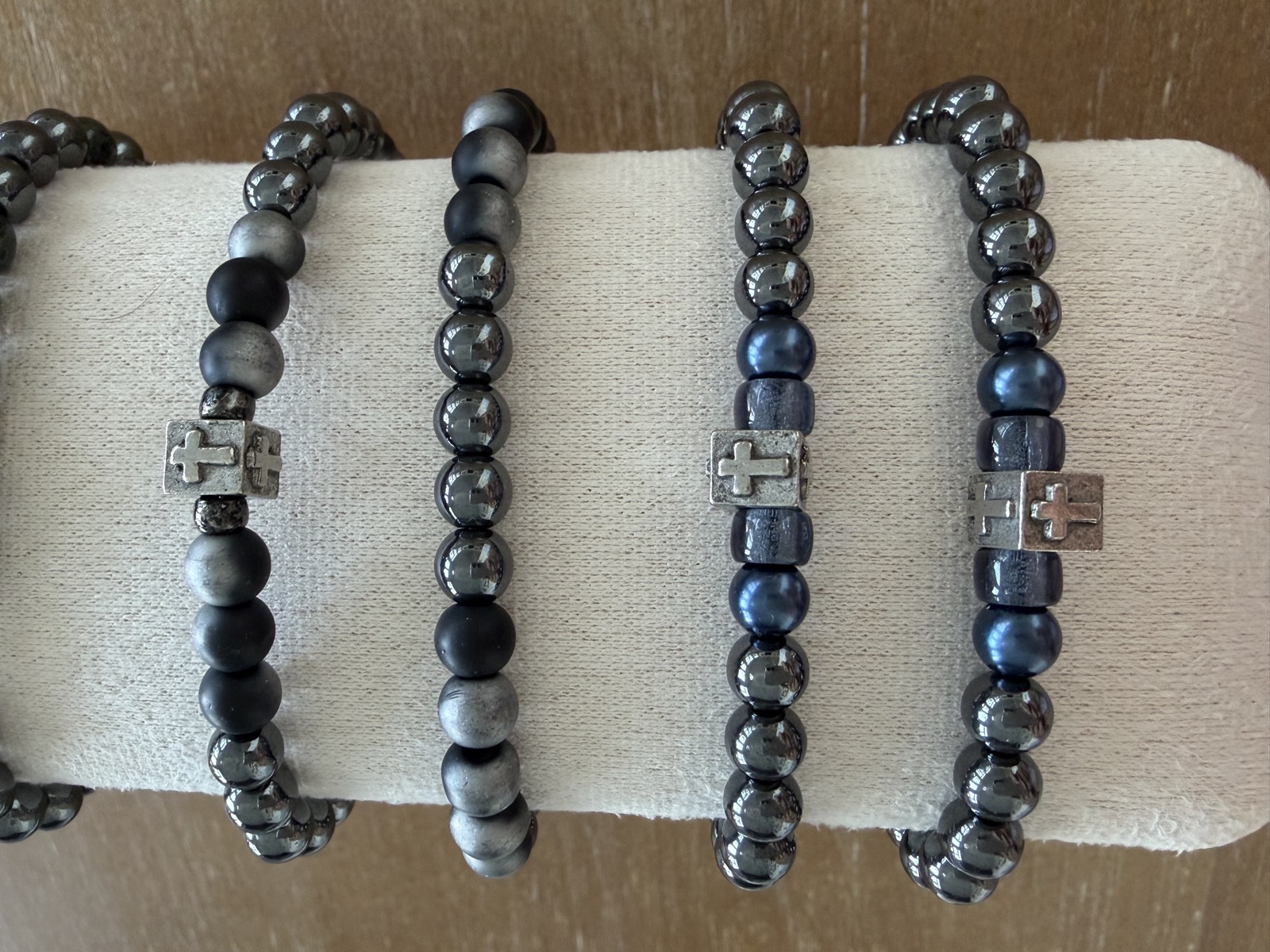 Five men's bracelets with cross details