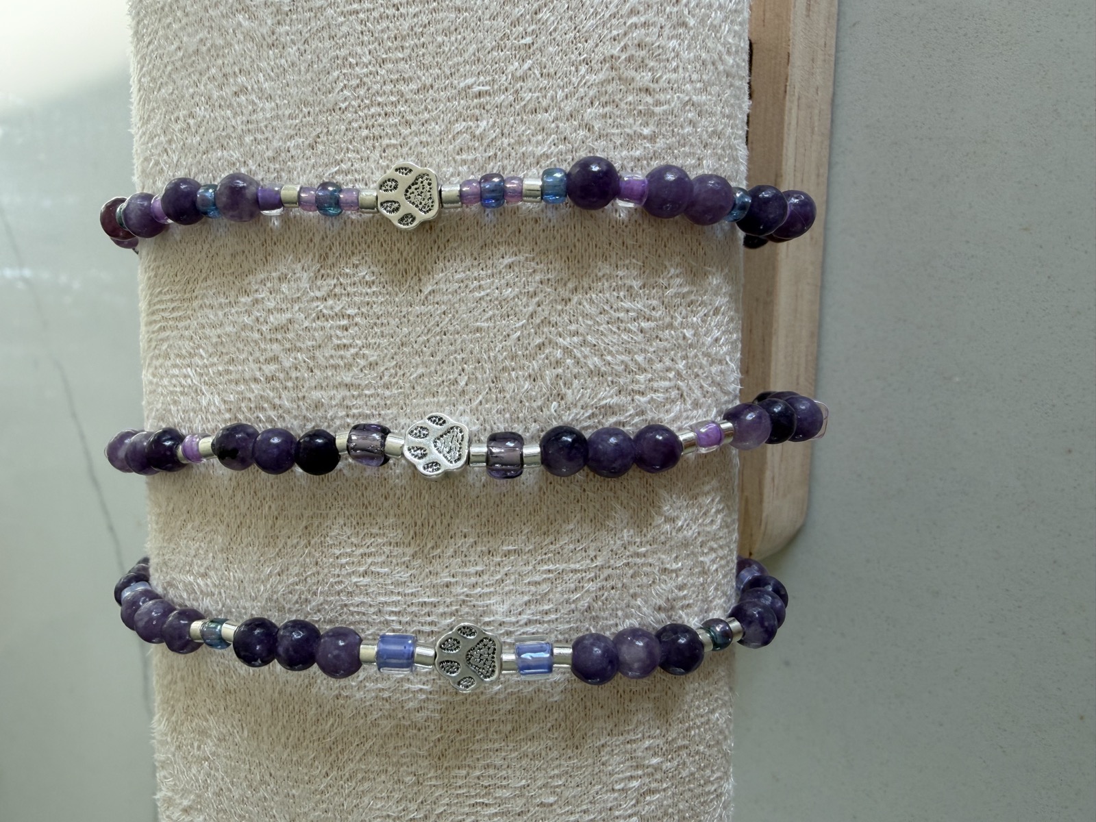 Women's amethyst stretch bracelets with paw print accent beads